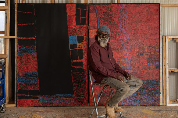 Noli Rictor, winner of the 2024 Telstra National Aboriginal and Torres Strait Islander Art Awards, with his work.