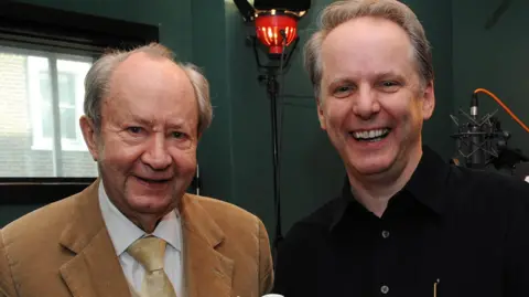 PA Media The original voice of Wallace, Peter Sallis with Nick Park in 2008