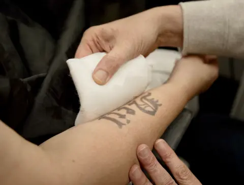 Stephen Fildes/BBC A close up of a fake Baby Neil tattoo on Ruth Jones's arm