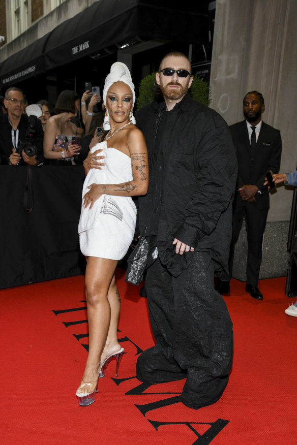 Doja Cat and Guram Gvasalia go off to the Met Gala. He wears oversized trousers, she wears ... a towel.