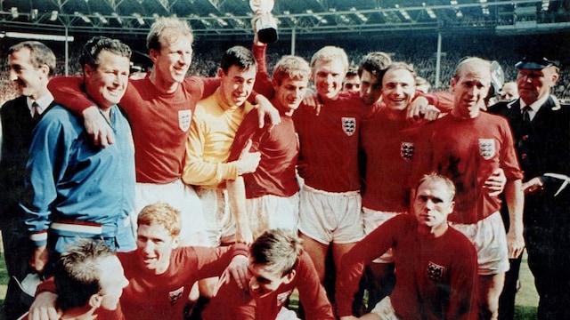 Victorious England footballers are all smiles as they celebrate the World Cup win with the Jules Rimet trophy at the Wembley Stadium. (Image: Reuters)