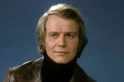 Getty Images David Soul from his "Hutch" days dressed in a brown leather jacket and black roll neck