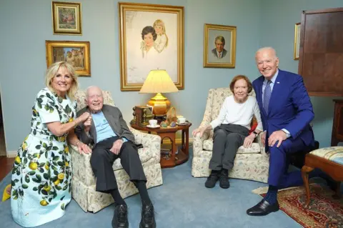 THE CARTER CENTER President Joe Biden and his wife Jill, visit the Carters in their home in in Georgia