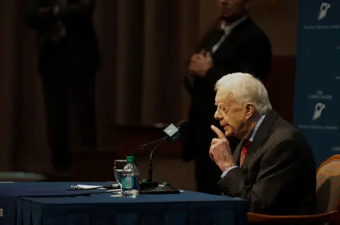 Getty Images Former U.S. president Jimmy Carter speaks at a news conference at the Carter Center in Atlanta, Georgia, U.S., on Thursday, Aug. 20, 2015. 