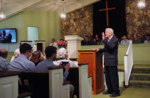 Getty Images Former U.S. President Jimmy Carter speaks to the congregation at Maranatha Baptist Church before teaching Sunday school in his hometown of Plains, Georgia on April 28, 2019.