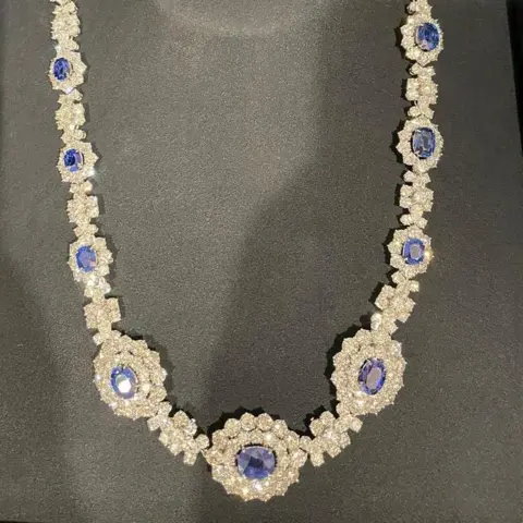 Met Police A diamond and sapphire necklace with many diamonds 