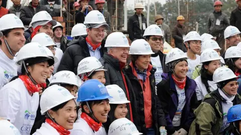 Getty Images Former US President Jimmy Carter attends a Habitat for Humanity work project in Qionglai in southwest China's Sichuan province Thursday November 19, 2009.