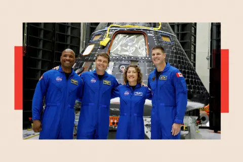 Reuters Four Astronauts in blue NASA uniforms, smiling at a press conference 