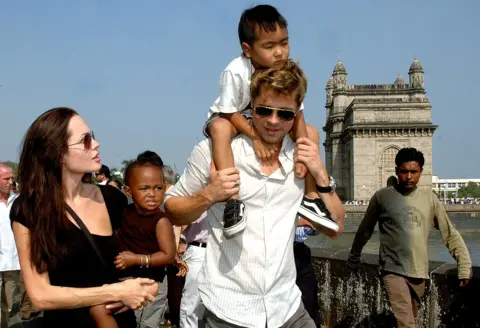 Getty Images The couple pictured with two of their children, Maddox and Zahara, while in Mumbai, India, where Jolie was filming A Mighty Heart in 2006