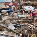 Macron visits Mayotte as thousand still missing after storm