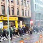 Football fans throw missiles in pre-match violence