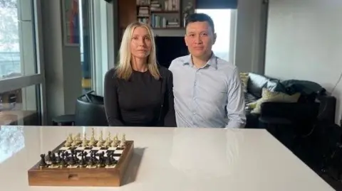 BBC Alex and Tum Nguyen sitting at a white table