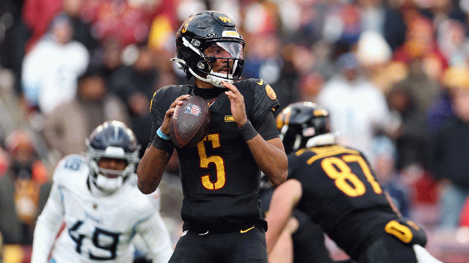 LANDOVER, MARYLAND - DECEMBER 01: Jayden Daniels #5 of the Washington Commanders looks to throw a pass in the third quarter of a game against the Tennessee Titans at Northwest Stadium on December 01, 2024 in Landover, Maryland. (Photo by Scott Taetsch/Getty Images)