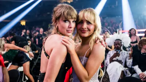 Getty Images Taylor Swift and Sabrina Carpenter pose together at the 2024 MTV Awards in New York