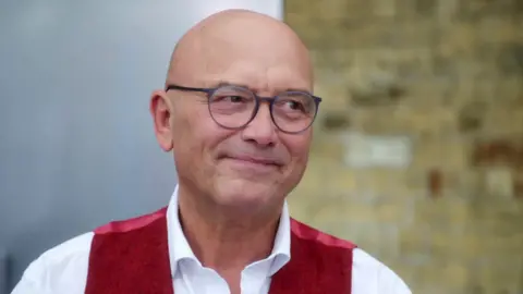 BBC/Shine TV Gregg Wallace in a white shirt and red waistcoat