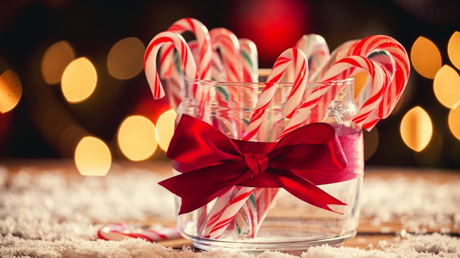 Candy canes in front of Christmas tree