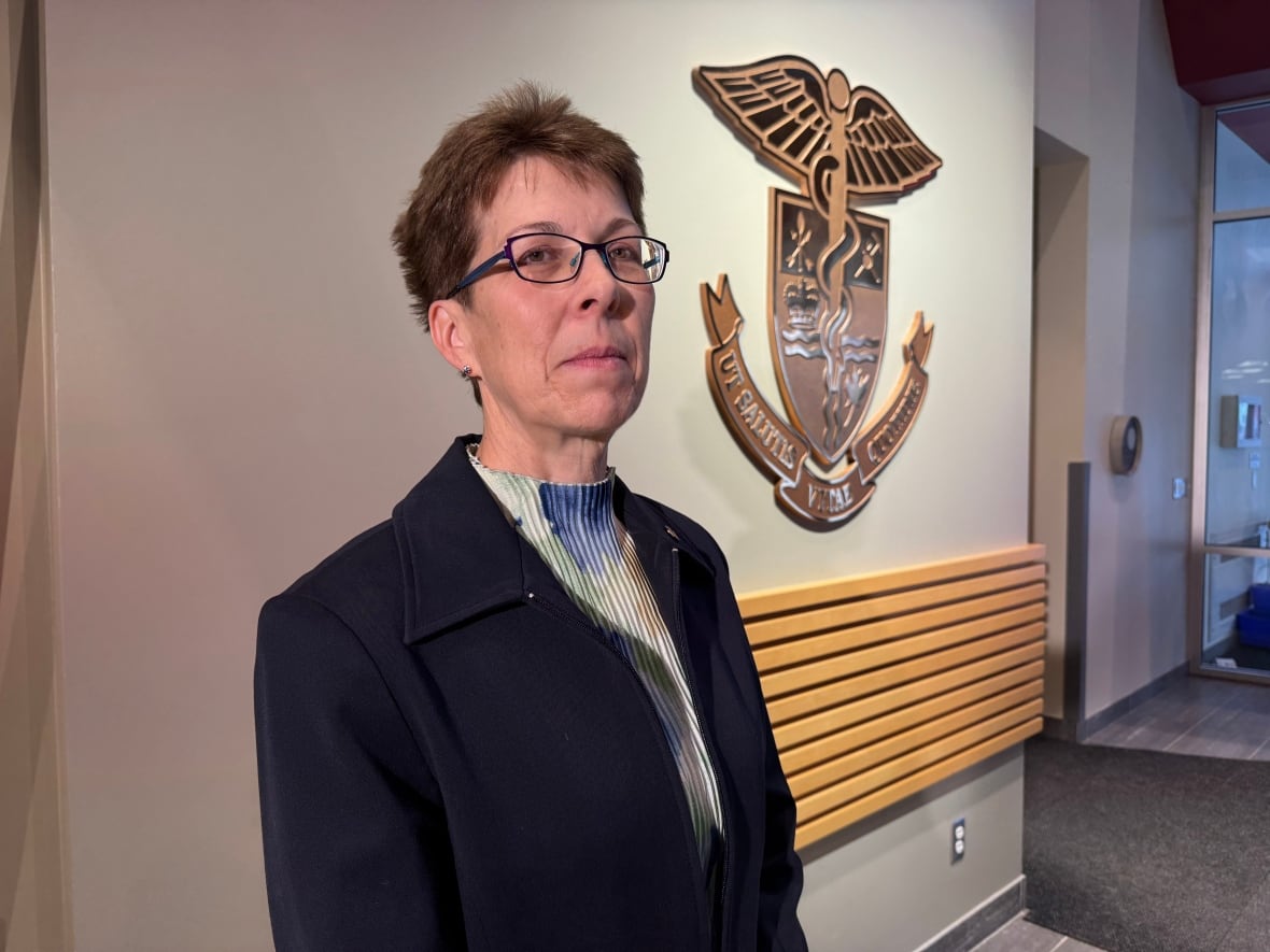 Renee MacPhee, an associate professor at Wilfred Laurier University, poses for a photo at the Ottawa Paramedic Service headquarters.