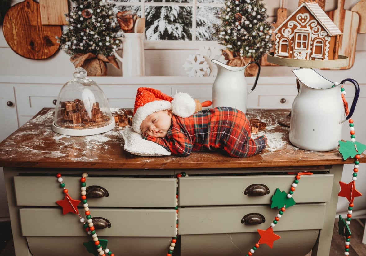 A baby in a christmas photo.