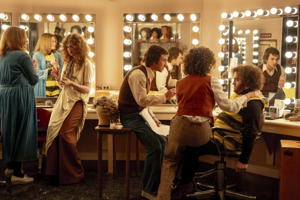 Gabriel La Belle (left) as Lorne Michaels, Rachel Sennott as Rosie Shuster, and Matt Wood as John Belushi in Saturday Night Live.