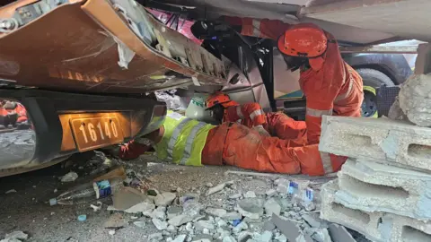 EPA A handout photo made available by the Vanuatu Police Force shows rescue teams conducting search and rescue operations following an earthquake in Port Vil