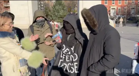 Talia Jane Men in hoodies in a park in New York City