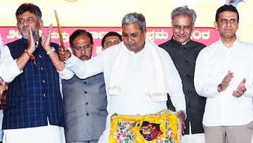 Karnataka Chief Minister Siddaramaiah with his deputy DK Shivakumar during 'Kannada Rajyotsava' award ceremony as part of the celebrations of Karnataka state formation day, at Vidhana Soudha, in Bengaluru. (PTI)