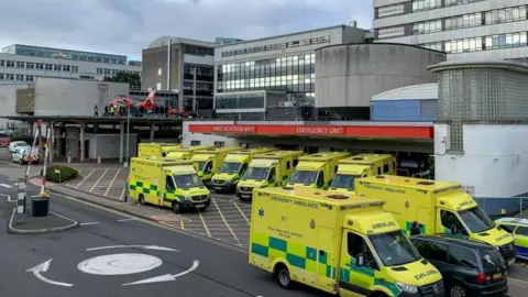 Getty Images A view of the Accident and Emergency Unit at the University Hospital Wales showing ambulances parked outside the Emergency unit together with one of the Welsh Air Ambulance on October 06, 2022 in Cardiff, Wales.