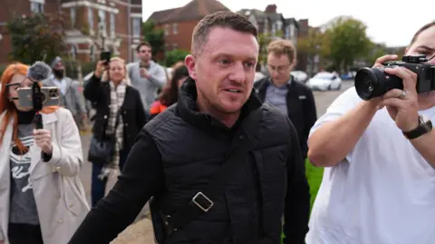 PA Media Tommy Robinson at Folkestone Police Station in October 2024