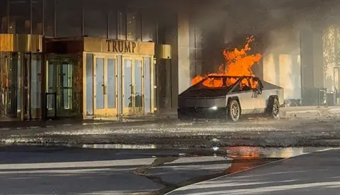 Alcides Antunes/via REUTERS In a screengrab taken from a social media video, flames rise from a Tesla Cybertruck after it exploded outside the Trump International Hotel in Las Vegas, Nevada - 1 January 2025