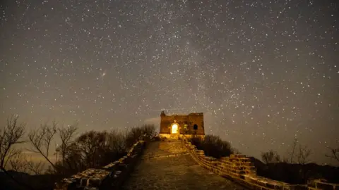 Getty Images Quadrantid meteor shower is observed in the night sky over the Great Wall on January 4, 2025 in Beijing, China.