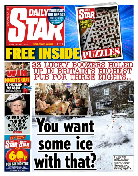 The headline in the Star reads: "23 lucky boozers holed up in Britain's highest pub for three nights". 