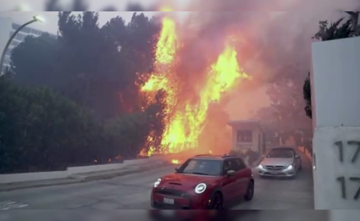 A wildfire tore through an upscale suburb north of Los Angeles on Tuesday.