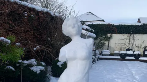 Sue B/BBC Weather Watchers A snow sculpture in a garden in Leeds