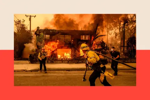 Getty Images Firefighters in front of a burning house