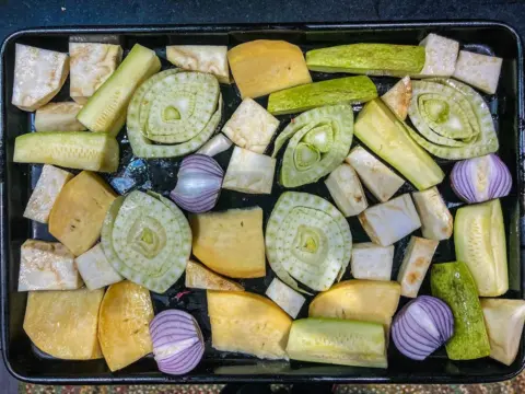 Duncan Holmes A selection of vegetables cut and prepared in a baking tray