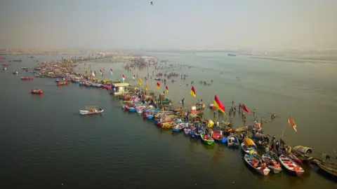 Ankit Srinivas The row of boats stands where the darker waters of Yamuna (left) meet the lighter, shallower waters of Ganges (right)