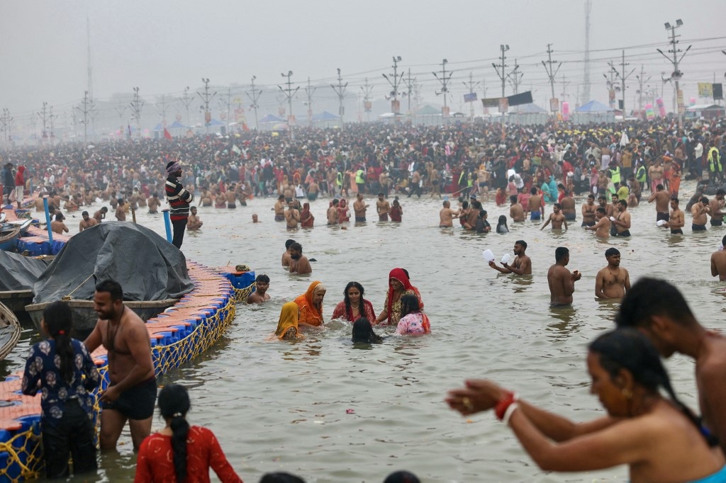 Pilgrims take a dip in the sacred waters of Sangam