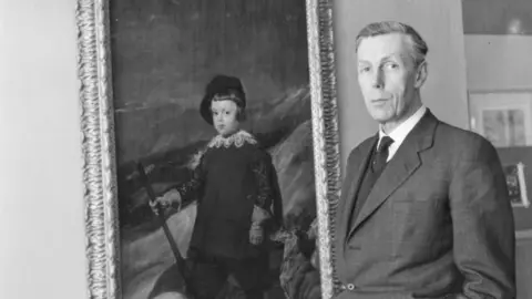 Getty Images Anthony Blunt, British art historian and Surveyor of the Queen's Pictures, with a painting by Velazquez