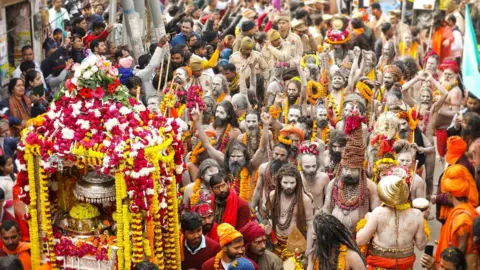 Ankit Srinivas Naga sadhus - the ash smeared naked Hindu holy men with matted dreadlocks - arrive in a procession in Prayagraj for the Kumbh Mela 2025