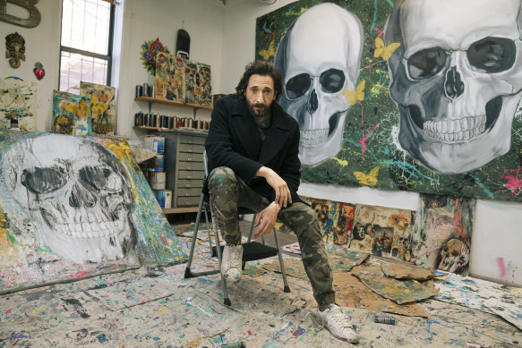 Adrien Brody with some of his paintings in 2022.