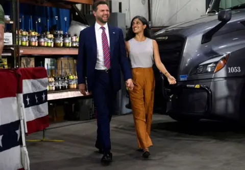 Getty Images JD Vance walks with Usha Vance