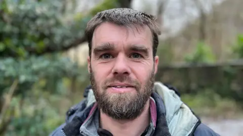 Gareth Davies, manager of the Arete Outdoor Centre in Llanrug, smiling at the camera.