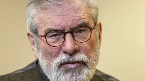 PA Media Gerry Adams - he has round-rimmed glasses, grey hair and a short grey beard