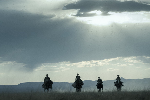 Taylor Kitsch as Isaac, Betty Gilpin as Sara Rowell, Shawnee Pourier as Two Moons and Preston Mota as Devin Rowell in American Primeval.