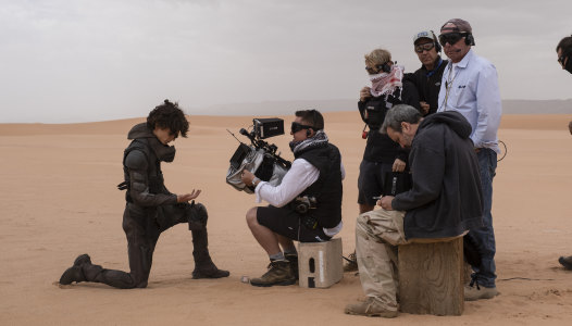 Cinematographer Greig Fraser films a scene with Timothee Chalamet on the set of Dune. 