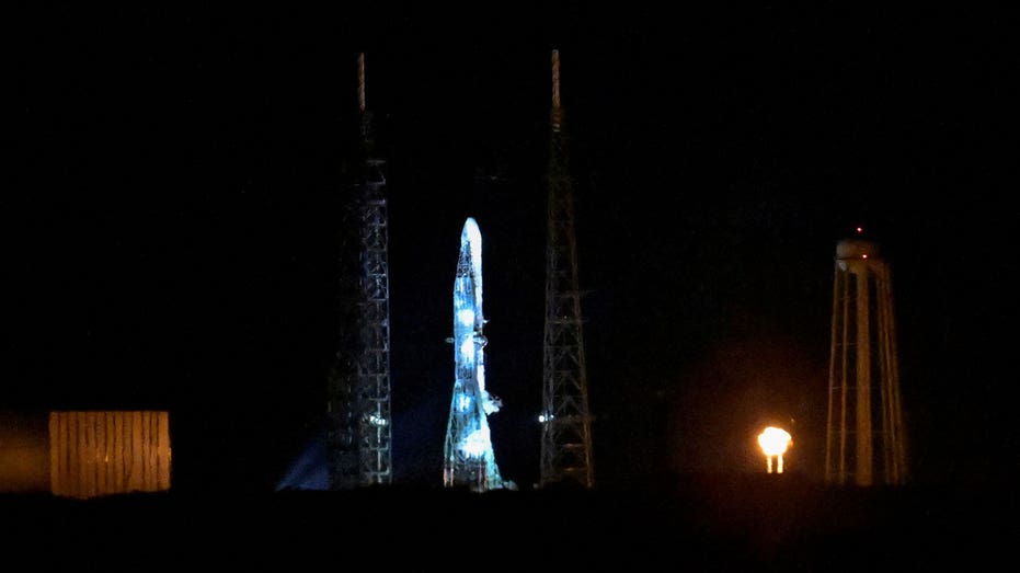 A Blue Origin New Glenn rocket stands ready during its attempt to launch.