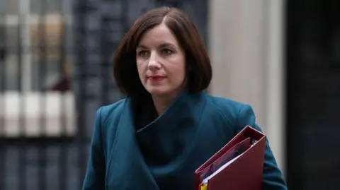 PA Education Secretary Bridget Phillipson, wearing a coat and carrying a red folder, leaves 10 Downing Street following a cabinet meeting