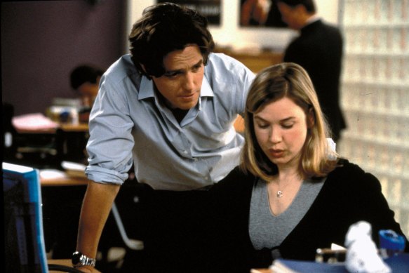 Hugh Grant as Daniel and Renee Zellweger as Bridget in an office scene from Bridget Jones’s Diary.