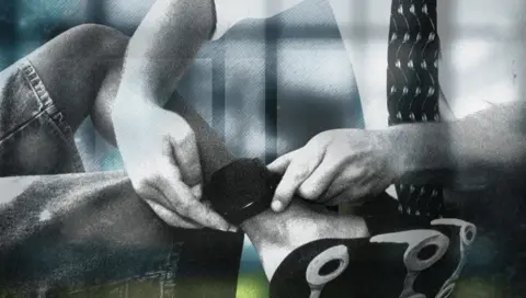 BBC Designed graphic showing a man fitting an ankle tag to another man's leg.  Electronic monitoring (known as ‘tagging’) is used in England and Wales to monitor curfews and conditions of a court or prison order.