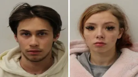 Met Police Mugshots of Bradley Harris and Summer betts Ramsey. Harris has long dark hair and is wearing a white hoodie. Betts Ramsey is wearing a pink dressing gown and has long dark eye lashes. Both are looking directly at the lense